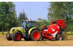 How does a hay baler work?